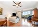 Living room with wood floors and light-filled view to balcony at 1300 Reece Rd # 402, Charlotte, NC 28209