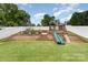 Large backyard featuring a multi-tiered play area and garden at 133 Glade Valley Ave, Mooresville, NC 28117