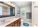 Neutral bathroom featuring a large mirror, vanity with wood cabinets, granite countertop, and tiled shower/tub combo at 133 Glade Valley Ave, Mooresville, NC 28117