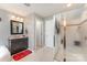 Bright bathroom featuring a vanity with storage, a shower with glass doors, and neutral walls at 133 Glade Valley Ave, Mooresville, NC 28117