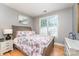 Cozy bedroom with hardwood floors, neutral walls and a large window for natural light at 133 Glade Valley Ave, Mooresville, NC 28117
