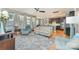 Open-concept living room with hardwood floors that connect to the kitchen area at 133 Glade Valley Ave, Mooresville, NC 28117