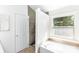Contemporary bathroom with a standalone tub, walk-in shower, and decorative window at 1581 Bluff Ct, Rock Hill, SC 29732