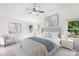 Well-lit bedroom features vaulted ceilings, a bed with a padded headboard, and matching nightstands at 1581 Bluff Ct, Rock Hill, SC 29732