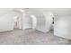 Spacious bedroom with neutral carpet, white walls, and many windows for natural light at 1581 Bluff Ct, Rock Hill, SC 29732