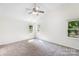 Spacious bedroom with ample natural light, neutral carpet, and vaulted ceiling at 1581 Bluff Ct, Rock Hill, SC 29732