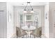 Cozy dining nook features a marble table and chairs under decorative lighting at 1581 Bluff Ct, Rock Hill, SC 29732