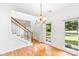 Elegant dining room boasts hardwood floors and natural light from large windows at 1581 Bluff Ct, Rock Hill, SC 29732