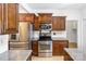 Well-equipped kitchen featuring stainless steel appliances, granite countertops, and ample cabinet space at 1581 Bluff Ct, Rock Hill, SC 29732