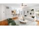 Open-concept living room with hardwood floors, a kitchen bar, and stylish, neutral decor at 1581 Bluff Ct, Rock Hill, SC 29732