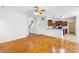 Open concept living space with hardwood floors flows from living to kitchen area at 1581 Bluff Ct, Rock Hill, SC 29732
