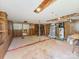 Unfinished basement space with wood paneled walls and exposed ceiling at 1606 N Rhyne St, Gastonia, NC 28054