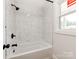 Bathroom boasting tiled shower and tub, and modern fixtures creating a serene atmosphere at 1606 N Rhyne St, Gastonia, NC 28054
