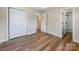 Bedroom with closet and bathroom access; features modern wood flooring at 1606 N Rhyne St, Gastonia, NC 28054