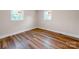 A bright bedroom with two large windows, modern flooring, and neutral walls for a relaxing ambiance at 1606 N Rhyne St, Gastonia, NC 28054