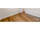 Bright bedroom features wood floors, white walls and trim, and an interior door at 1606 N Rhyne St, Gastonia, NC 28054