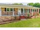 Charming brick home with a cozy front porch and black iron railings at 1606 N Rhyne St, Gastonia, NC 28054