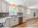 Bright kitchen with white cabinetry, stainless appliances and fixtures and an open design at 1606 N Rhyne St, Gastonia, NC 28054
