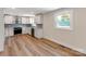 Modern kitchen features white cabinets, stainless steel appliances, and sleek countertops at 1606 N Rhyne St, Gastonia, NC 28054