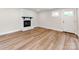 Spacious living room features new floors and a charming brick fireplace at 1606 N Rhyne St, Gastonia, NC 28054