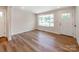Bright, open room features new flooring, large windows, and a white door at 1606 N Rhyne St, Gastonia, NC 28054