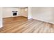 Spacious living room features new floors and a charming brick fireplace at 1606 N Rhyne St, Gastonia, NC 28054