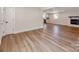 Inviting living room features new flooring and an open layout to the kitchen at 1606 N Rhyne St, Gastonia, NC 28054