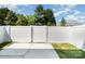 View of the fenced backyard with a concrete patio and an area of grass at 172 Briana Marie Way, Indian Trail, NC 28079