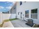 Backyard patio with an air conditioning unit and a partial view of the neighborhood at 172 Briana Marie Way, Indian Trail, NC 28079