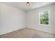 Bright bedroom with a window view of greenery and neutral carpet at 172 Briana Marie Way, Indian Trail, NC 28079
