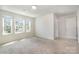 Bright bedroom with carpet, white trim, and multiple windows at 172 Briana Marie Way, Indian Trail, NC 28079