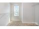 Walk-in closet with built-in shelving and a window for natural light at 172 Briana Marie Way, Indian Trail, NC 28079
