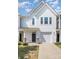 Well-maintained townhouse with a single-car garage and neat landscaping at 172 Briana Marie Way, Indian Trail, NC 28079