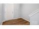 Bright foyer featuring wood-look floors and a classic white front door at 172 Briana Marie Way, Indian Trail, NC 28079