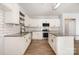 Modern kitchen with white cabinets, stainless steel appliances, a kitchen island, and granite countertops at 172 Briana Marie Way, Indian Trail, NC 28079