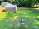 A lush backyard with a storage shed and privacy fence at 1723 Lowder St, Albemarle, NC 28001