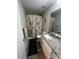 A clean and functional bathroom with a modern granite countertop and new fixtures at 1723 Lowder St, Albemarle, NC 28001
