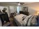 A functional bedroom with a decorative bed, dresser, and an office setup at 1723 Lowder St, Albemarle, NC 28001