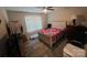 Cozy bedroom features a ceiling fan, neutral walls and a window at 1723 Lowder St, Albemarle, NC 28001