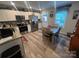 Spacious kitchen with white cabinets, stainless appliances, and adjacent dining area at 1723 Lowder St, Albemarle, NC 28001