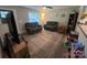 Comfortable living room with a plush rug, reclining sofas, and natural light at 1723 Lowder St, Albemarle, NC 28001