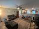 Open concept living room seamlessly flows into the kitchen with modern recessed lighting at 1723 Lowder St, Albemarle, NC 28001