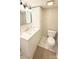 Clean bathroom with marble floors, modern vanity, and a white toilet, ensuring functionality and style at 210 W Church St, Cherryville, NC 28021