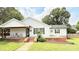 Charming single-story home with white siding, a cozy porch, and a well-maintained front yard at 210 W Church St, Cherryville, NC 28021