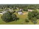 Wide aerial view of a home featuring an outdoor deck, a sprawling lawn, and mature trees at 2268 Bay Ct, Newton, NC 28658