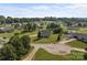 Expansive aerial shot showing neighborhood with lush greenery and single-story homes and long driveways at 2268 Bay Ct, Newton, NC 28658
