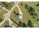 Bird's-eye view of a well-maintained home with expansive green lawn, mature trees, and private driveway at 2268 Bay Ct, Newton, NC 28658
