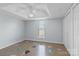 Cozy bedroom with a ceiling fan, neutral walls and floors, and a window and closet at 2268 Bay Ct, Newton, NC 28658