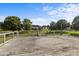 Open wood deck with metal railing overlooks the lawn and surrounding neighborhood at 2268 Bay Ct, Newton, NC 28658