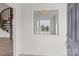 Bright entryway featuring a wooden spiral staircase, a large window, and tiled floors at 2268 Bay Ct, Newton, NC 28658